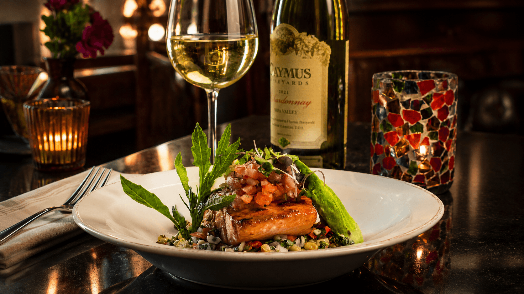 Grilled avocado salmon with pico de gallo, corn relish, and Caymus Chardonnay