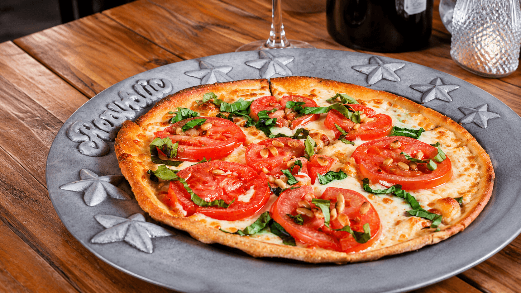 Wood-fired Margherita pizza on the branded Republic platter